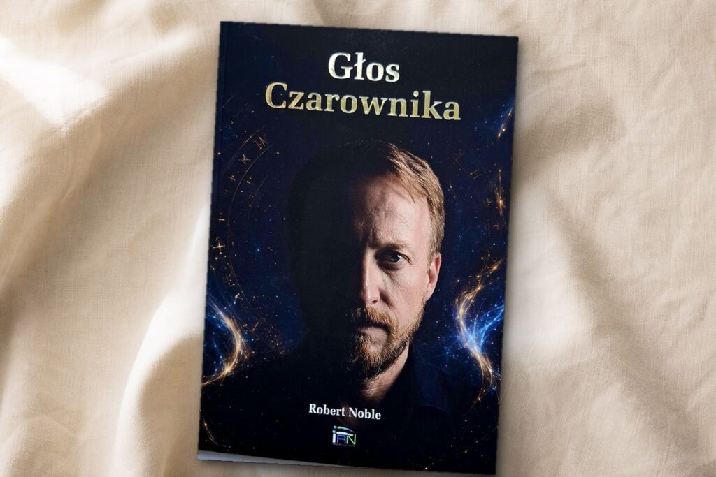 Książka Głos Czarownika Roberta Noble na jasnym lnianym tle